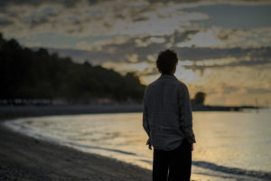 portrait of Avraham Cohen at sunset on a beach
